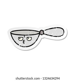 distressed sticker of a cute cartoon measuring spoon