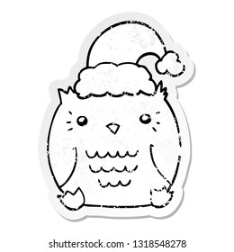 distressed sticker of a cute cartoon owl wearing christmas hat