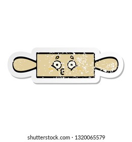 distressed sticker of a cute cartoon rolling pin