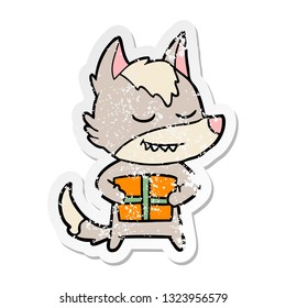 distressed sticker of a friendly cartoon wolf carrying christmas present