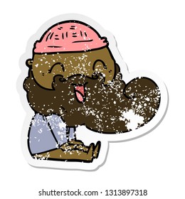 distressed sticker of a happy bearded man sat down laughing