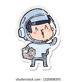 distressed sticker of a happy cartoon astronaut with moon rock