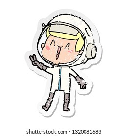 distressed sticker of a happy cartoon astronaut giving peace sign