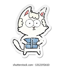 distressed sticker of a happy cartoon cat with present