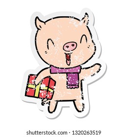 distressed sticker of a happy cartoon pig with xmas present