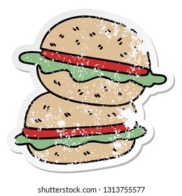 distressed sticker of a quirky hand drawn cartoon veggie burger