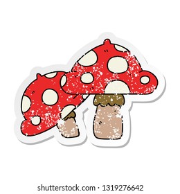 distressed sticker of a quirky hand drawn cartoon toadstools