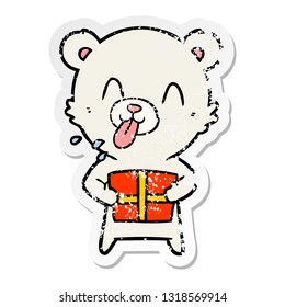 distressed sticker of a rude cartoon polar bear sticking out tongue with present
