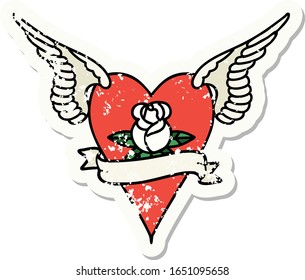 distressed sticker tattoo in traditional style of a flying heart with flowers and banner