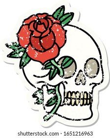 distressed sticker tattoo in traditional style of a skull and rose