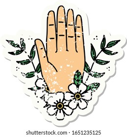 distressed sticker tattoo in traditional style of a hand and flower