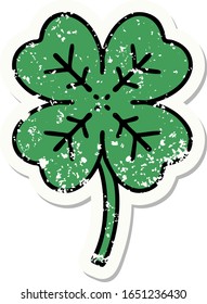 distressed sticker tattoo in traditional style of a 4 leaf clover