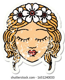 distressed sticker tattoo in traditional style of a maidens face