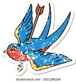 distressed sticker tattoo in traditional style of a swallow