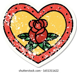 distressed sticker tattoo in traditional style of a heart and flowers