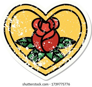 distressed sticker tattoo in traditional style of a heart and flowers