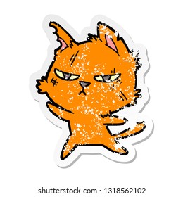 distressed sticker of a tough cartoon cat