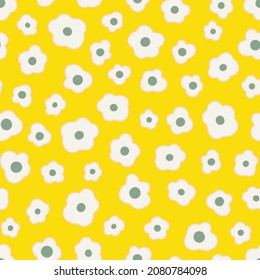 Ditsy daisy flowers seamless repeat pattern. Random placed, vector botany millefleurs all over surface print on yellow background.