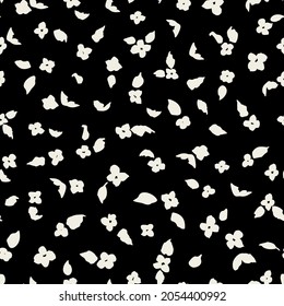 Ditsy daisy silhouettes seamless repeat pattern on black background. Random placed, vector flowers with leaves all over surface print.