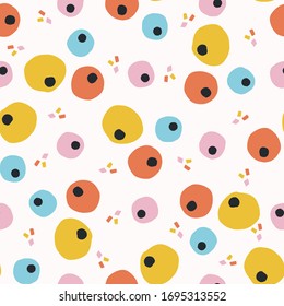 
Ditsy dotty shapes seamless vector background pattern. Stylized paper cut out matisse style texture. Kawaii modern retro 50's style decor swatch. Decorative bright flat color fun all over print