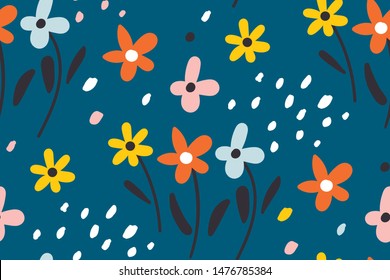 Ditsy floral background.Cute pattern in small flower. Small colorful flowers. Seamless repeat pattern with flowers and leaves on a blue background. Creative kids for fabric, wrapping, textile.