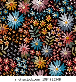 Ditsy floral seamless pattern. Colorful embroidery flowers on black background. Fashion design. Vector illustration.