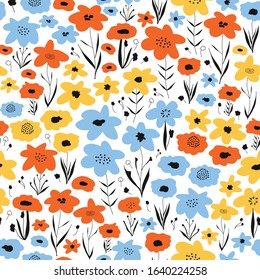 Ditsy flower field seamless vector pattern. Blue orange yellow black floral background. Repeating flower backdrop. Summer or spring nature design. Use for fabric, kids wear, wrapping, surface decor