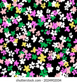 Ditsy flower seamless pattern. Simple floral texture in cartoon style. Flower buds silhouettes all over the print. Small meadow plants. Flat summer botanical background. For fabric and texture.