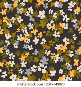 Ditsy flower seamless pattern. Simple floral texture in cartoon style. Flower buds silhouettes all over the print. Small meadow plants. Flat summer botanical background. For fabric and texture.