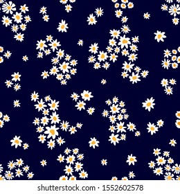 Ditsy Pattern with Small Daisies. Seamless vector pattern with wildflowers. Summer textile collection. On dark background.