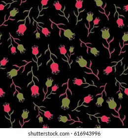 Ditsy style. Flower vector seamless pattern in vintage style. Small flowers in red, pink and green colors on a black background. Hand drawn vector illustration.