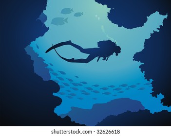 The diver floats through reeves in an environment of fishes