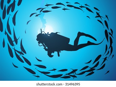 The diver is surrounded with a jamb of fishes