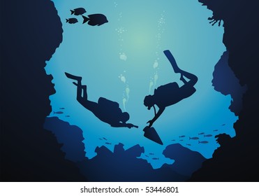 The diver is surrounded with a jamb of fishes