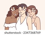 Diverse beautiful women with flowers in hair are dressed in elegant dresses for wedding ceremony. Three multicultural young bridesmaids at wedding ceremony or white party attendees