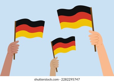 Diversas manos de la gente sosteniendo banderas alemanas. Bandera de Alemania. Ilustración vectorial en estilo plano sobre fondo azul.