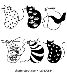 a diverse set of black and white cats