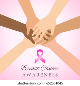 Diverse women hands joining for breast cancer awareness