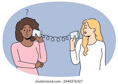 Diverse women talk with tin can telephone have misunderstanding. Multiracial friends speak on handmade can phone having problems communicating. Vector illustration.