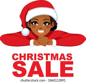 Diverse women wearing Santa hat smiling with red Christmas sale text