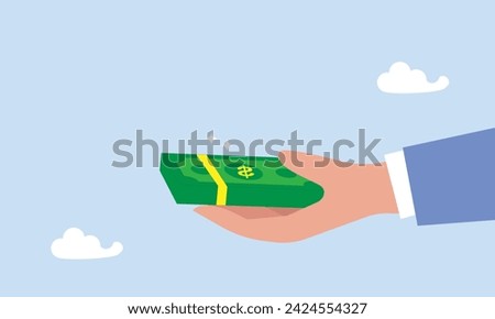 Dividends stock payment, passive income from dividend yield concept, rich and wealthy businessman hand holding pile of dollar money banknotes with the word Dividends.