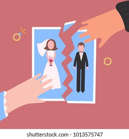 Divorcement. Man and woman hand tear apart wedding photo. Break up of relationship. End of family life. Diamond engagement rings. Disengagement of young former wife and husband. Divorce concept