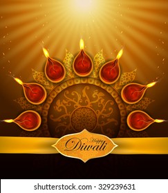 Diwali Holiday greeting card with burning di ya.