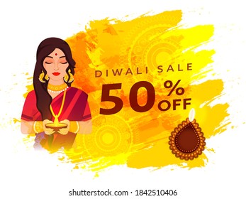 Diwali Sale Poster Design with 50% Discount Offer, Illustration of Beautiful Indian Woman Holding Oil Lamp (Diya) on Brush Stroke Background.