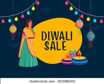 Diwali Sale Poster Design with Indian Young Woman Holding a Empty Plate, Lit Oil Lamps, Gift Box, Hanging Lanterns and Lighting Garland on Blue and Yellow Background.