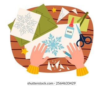 DIY christmas paper craft. Top view on table with little hands making application of snowflake vector illustration. Paper Christmas craft vector illustration