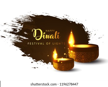 Diya Lamps lit during Diwali Celebration on Grungy Texture Background. Happy Diwali.
