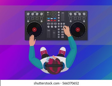 DJ Playing Vinyl On The Neon Color Light Background. Top View. DJ Interface Workspace Mixer Console Turntables. Night Club Concept. DJ Young Man