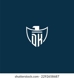 DK initial monogram logo for shield with eagle image vector design