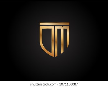 DM shield shape Letter Design in gold color